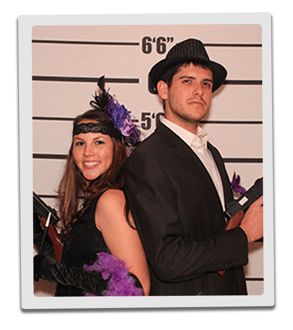 Tampa Murder Mystery party guests pose for mugshots