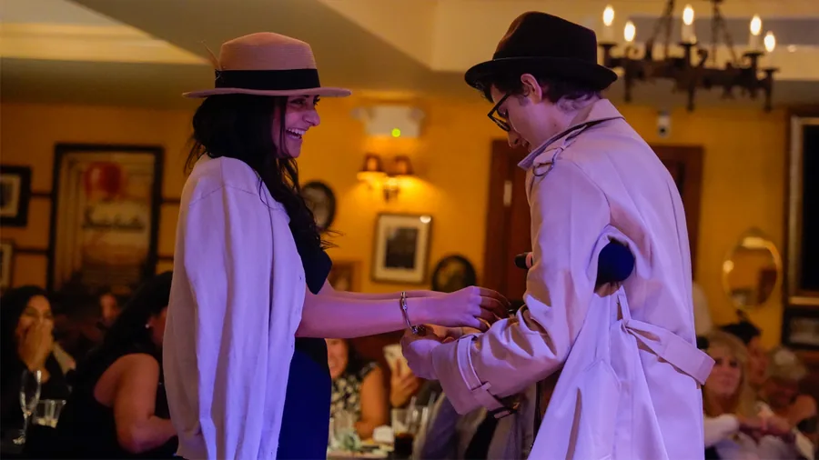 A Murder Mystery Company detective questioning a guest at a Tampa show