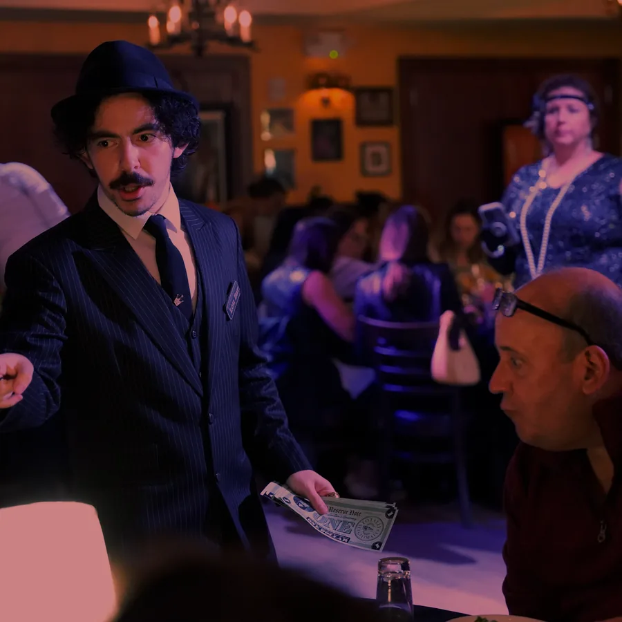 A Murder Mystery Company actor working the room at a Tampa show