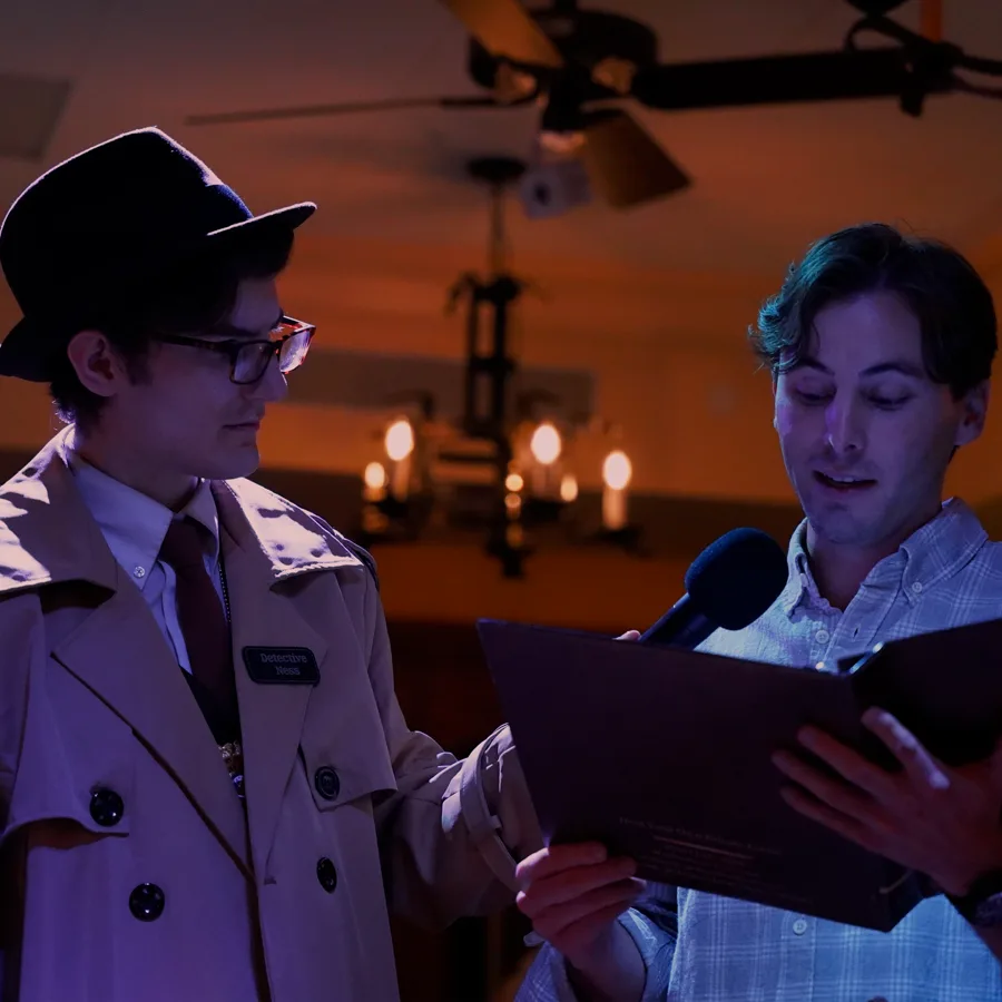 Professional actors performing at a Tampa murder mystery